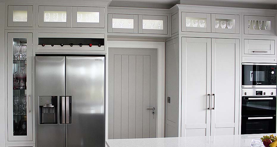 Peninsula Kitchens - stainless steel fittings in a white shaker kitchen